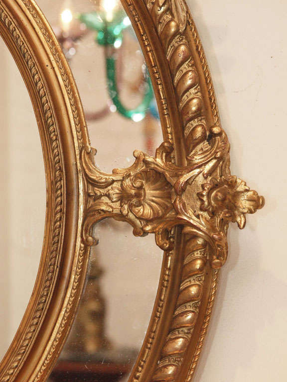 A Fine Pair of Antique Oval Carved Giltwood and Gesso Mirrors For Sale 2
