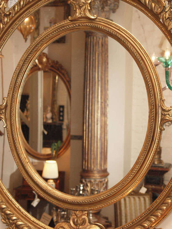 A Fine Pair of Antique Oval Carved Giltwood and Gesso Mirrors For Sale 4