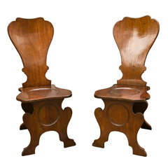 A Pair of George III Oak Hall Chairs