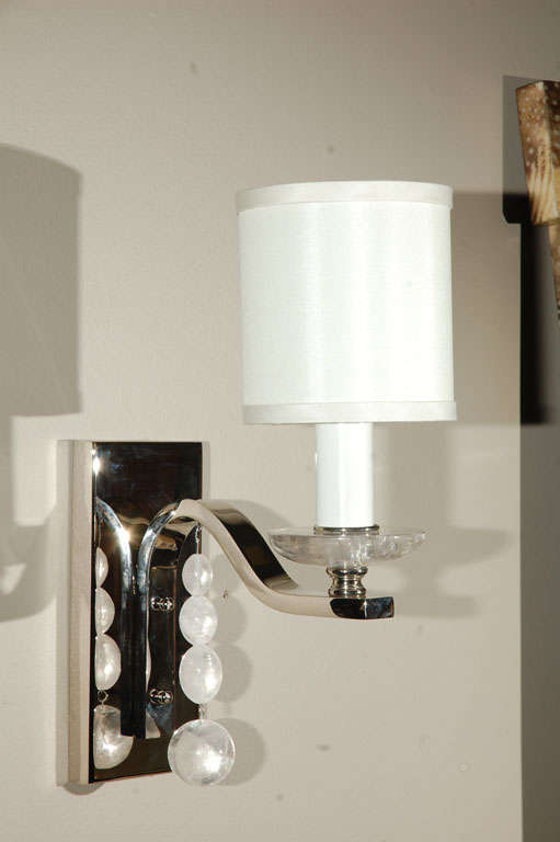 Paul Marra Glass Ball Sconce shown with oval rock crystal balls, bobeche, and 1.5