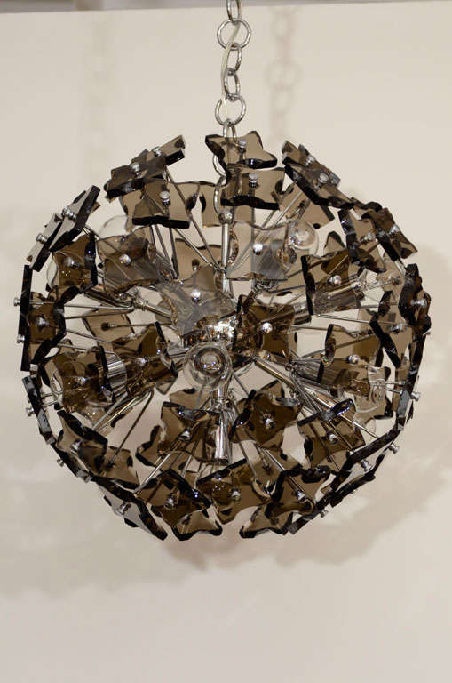Fantastic sputnik chandelier composed of square, faceted smoked glass elements on a chrome armiture. Chandelier has 7 light sources.