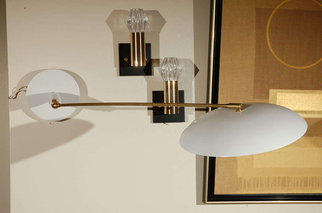 French 1960s wall articulated light in the style of Pierre Guariche.