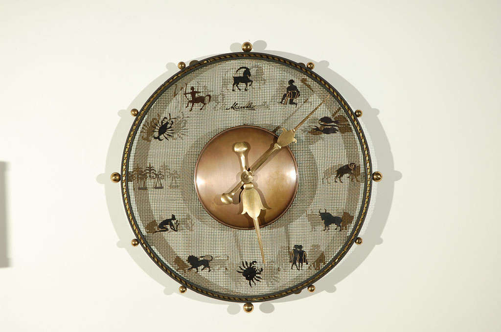 Mauthe iron zodiac wall clock with brass features, this is one that is in pristine condition.