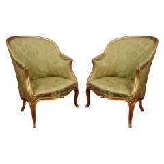 A Pair Of Louis XV Silk Upholstered Giltwood Bergeres