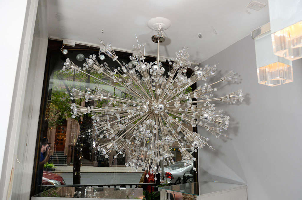 Custom crystal starburst Sputnik chandelier in an oval shape and nickel plated finish. Customization available in different sizes, shapes and finishes.