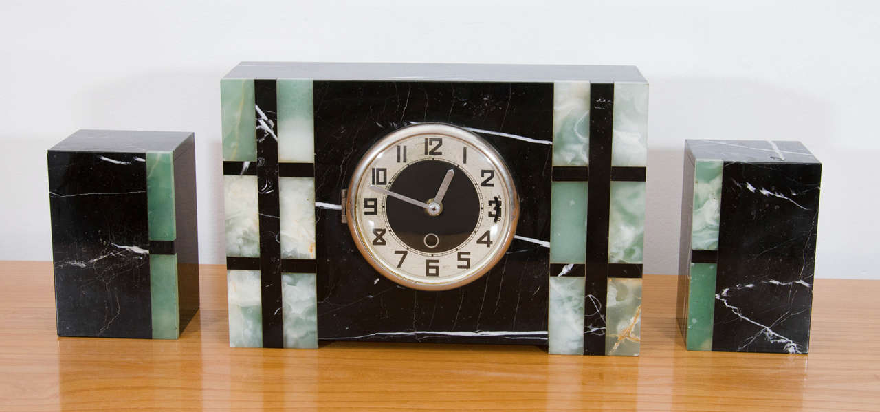 Sometimes thought to be used as bookends, this clock's matching 