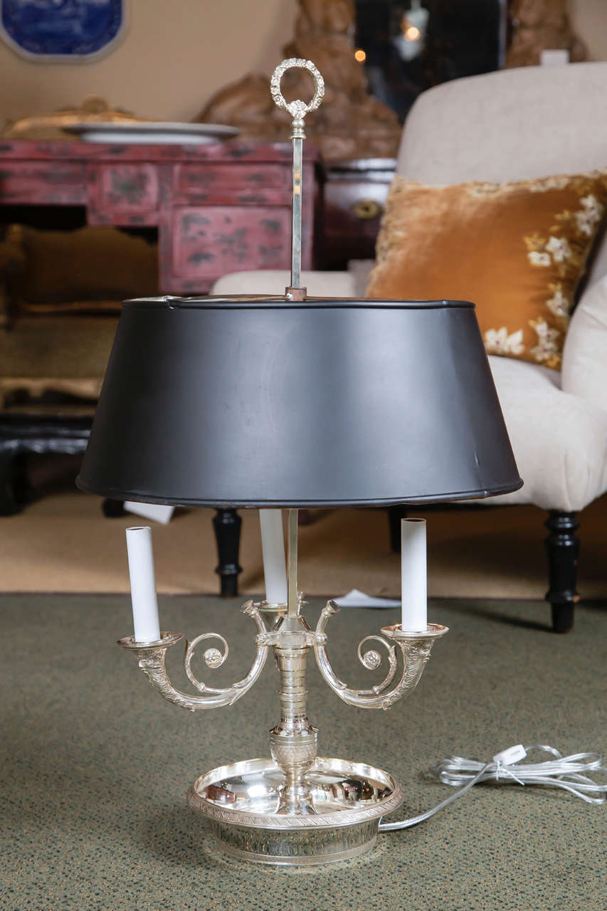 A lovely 19th century French three-light silver plated bronze bouillotte lamp.