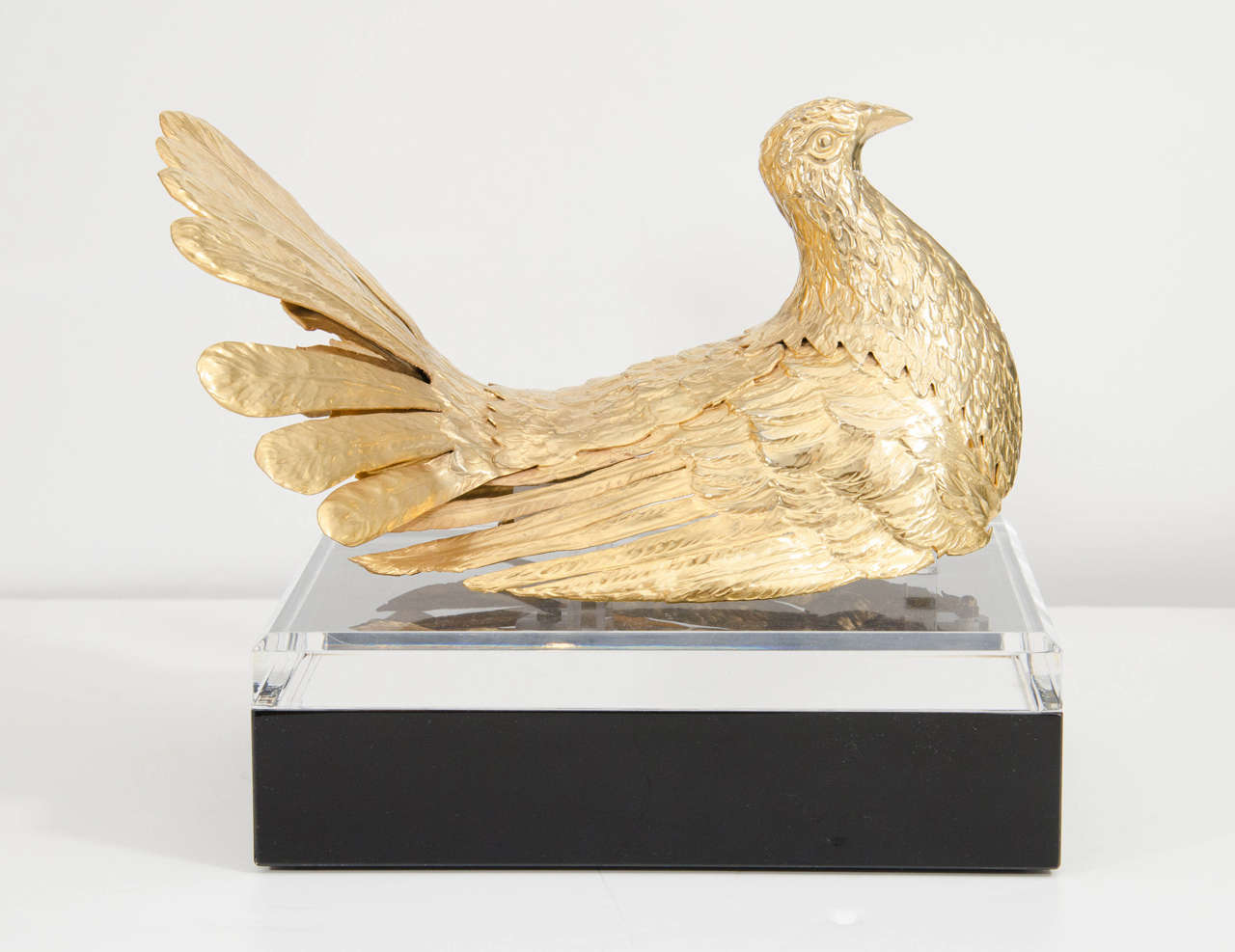 Pair of gilt brass bird sculptures by Gabriella Crespi on later Lucite box bases.