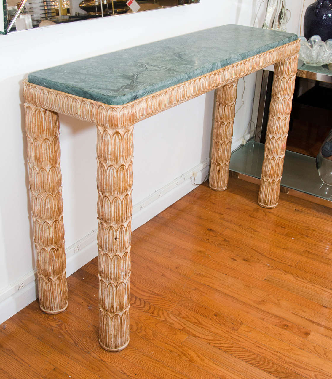 Carved, pickled wood console table with green marble top.