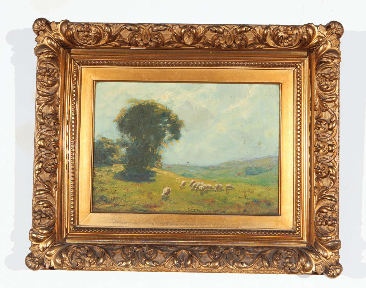 Day sheep herding scene in elaborate gold frame.
