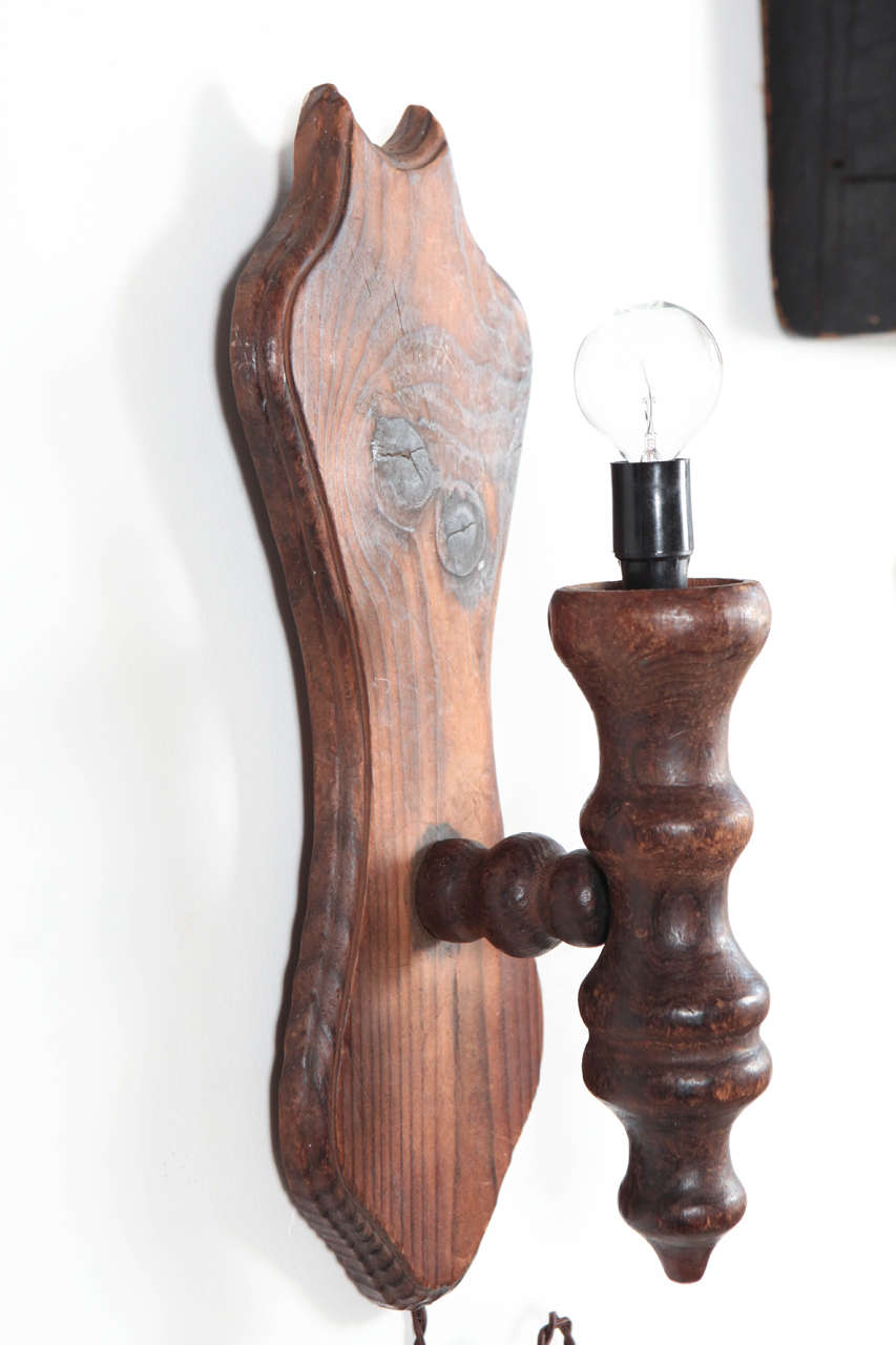 Wooden wall sconces, sold individually, four available.