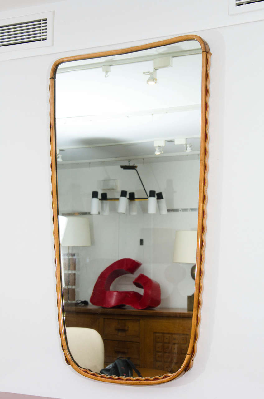 Mirror by Osvaldo Borsani with matching console, sold separately. Scallop frame detail.
