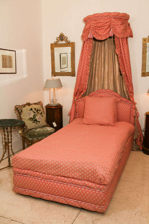 Pink Porthault cotton upholstered bed with adjustable canopy.  Designed by Henri<br />
Samuel