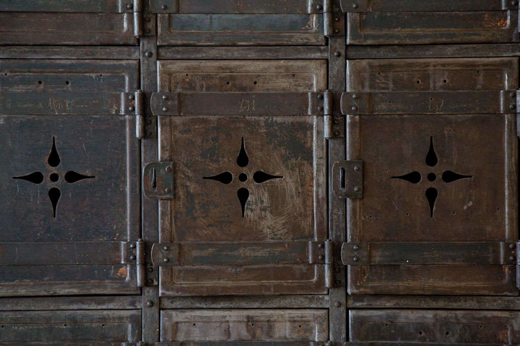 an amazing set of lockers from a belgian coal mine. a stand-out piece with a graceful design within each door. a true piece of art.