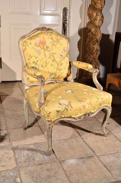 a period Louis XV fauteuil / arm chair with gray painted carved frame, newly upholstered in yellow floral fabric 

15.5