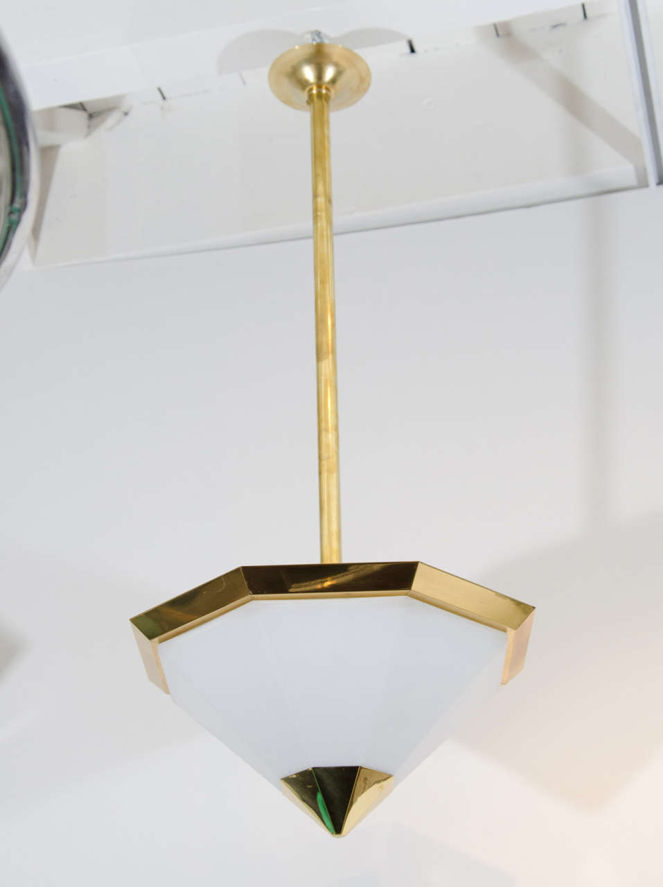 Pair of octagonal brass pendant light fixtures with faceted frosted glass shades. Also available as ceiling lights.
Six available. Height adjustable.