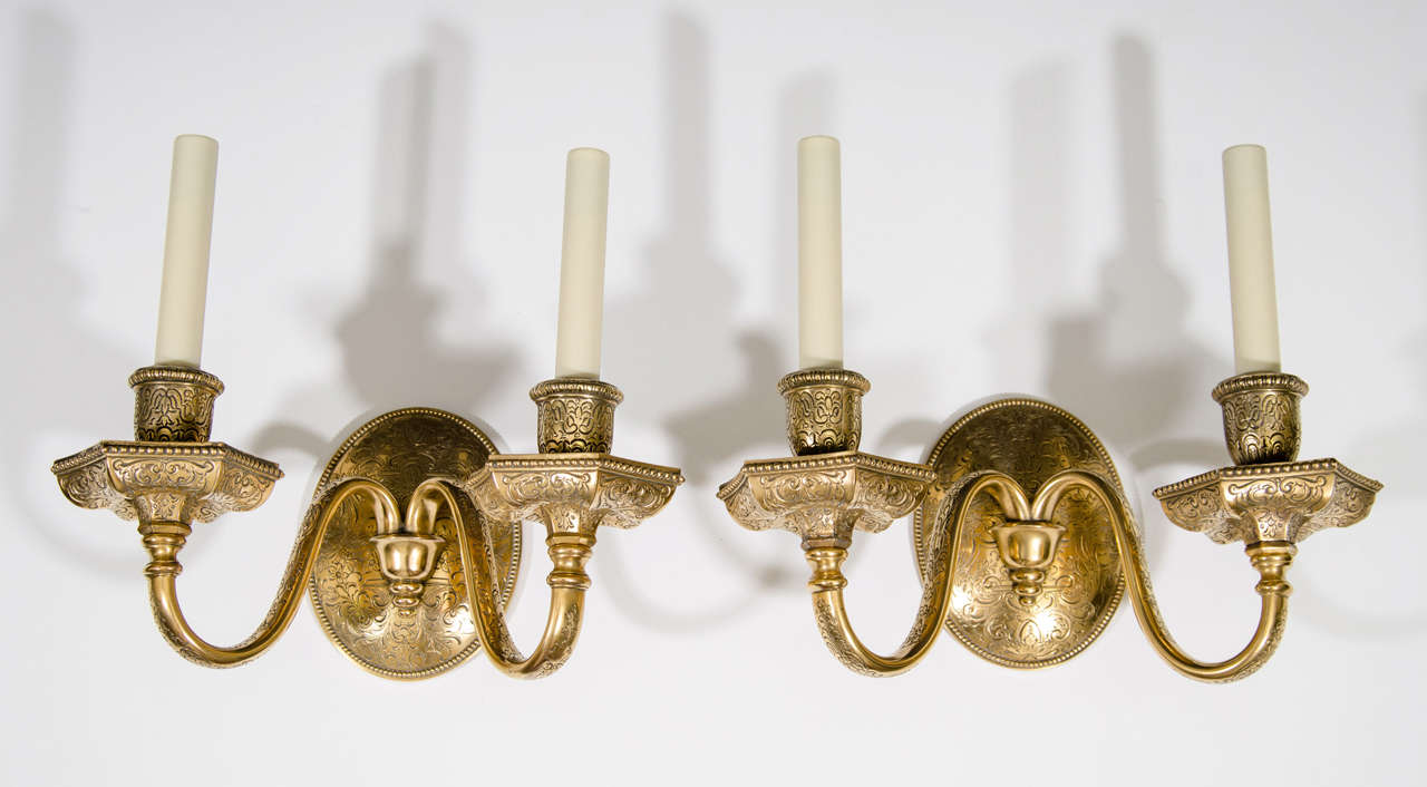 Pair of Two Light Gilt Bronze Sconces With Filigree Decoration On Back Plate And Bobeches.