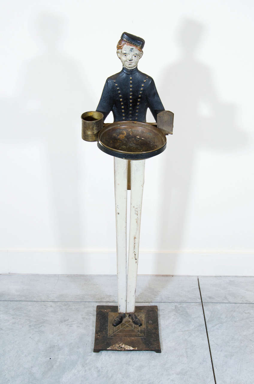 An iconic and nicely painted American cast iron bellhop smoking stand with match and cigarette holders. A great piece of Americana. USA, c.1940's.
TN126