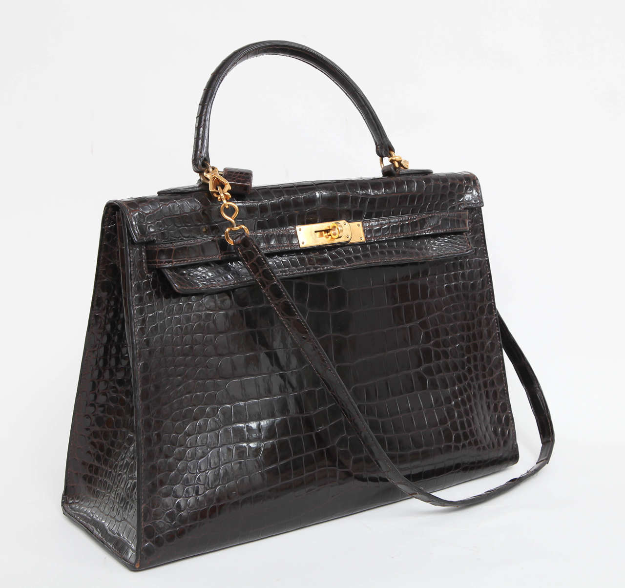 A fabulous vintage classic in dark brown alligator Hermes Kelly bag from the 1960s with rare lock in great condition
This is an unusual size  which has not been made for several years,