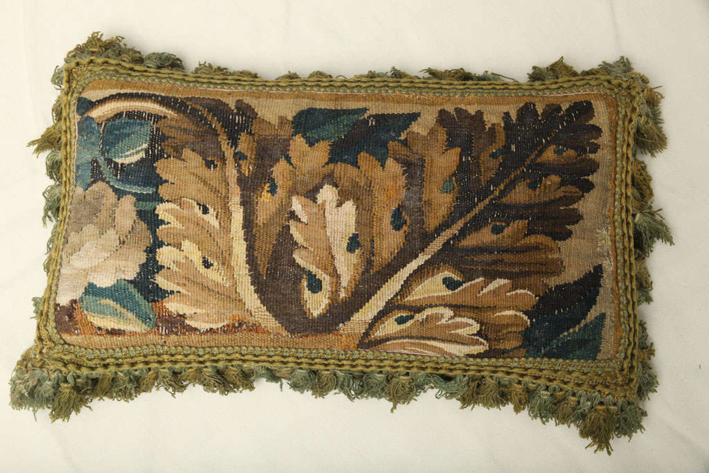 A PAIR OF VERDURE TAPESTRY FACED CUSHIONS. FLEMISH, 17th CENTURY In Good Condition For Sale In New York, NY