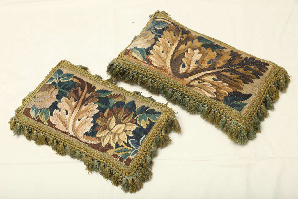 RECTANGULAR, EACH APPLIED WITH A MODERN TASSELED FRINGE AND SILK BACKING.<br />
DIMENSIONS WITHOUT FRINGE:<br />
ONE CUSHION, 18 1/2