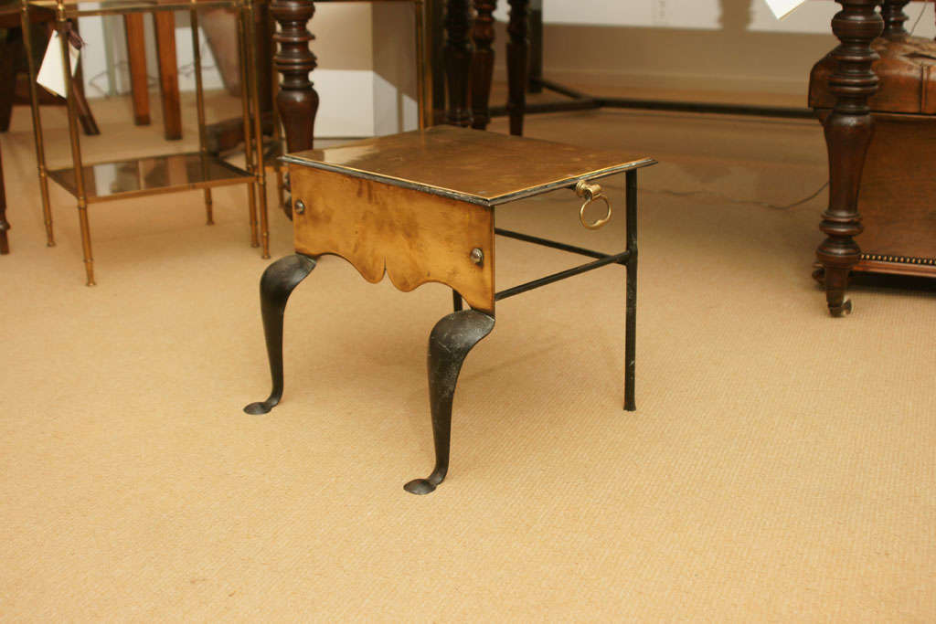 A brass and steel footman with cabriole legs - great as a low side table next to a chair or as a library step stool.