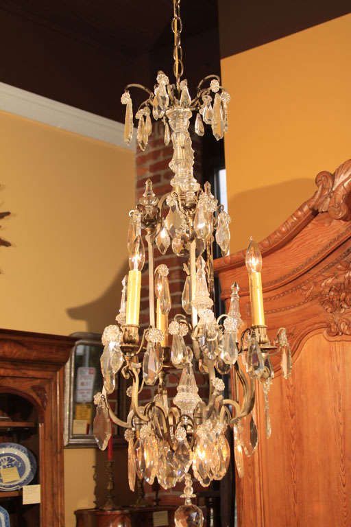 Narrow French Crystal Chandelier with Six Lights

This chandelier features three standard candleabra lights on the top tier and three upside down lights under the bottom.

Lovely spire design in a nice narrow shape for a tight