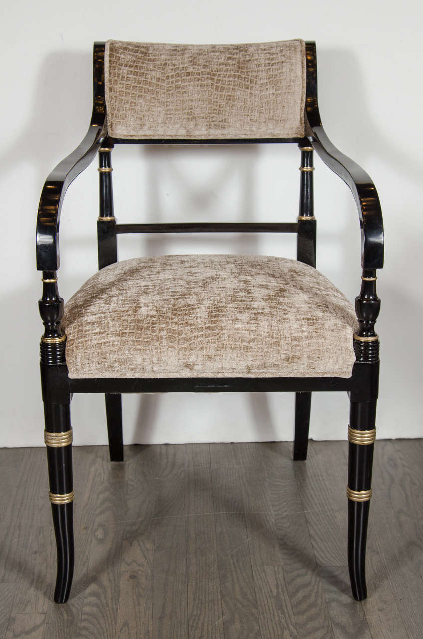 This pair of superb Mid-Century Modernist scroll arm chairs in ebonized walnut feature intricate neoclassical detailing throughout with gilt accents and new gauffraged crocodile velvet upholstery in bronze tones. Restored to mint condition.

