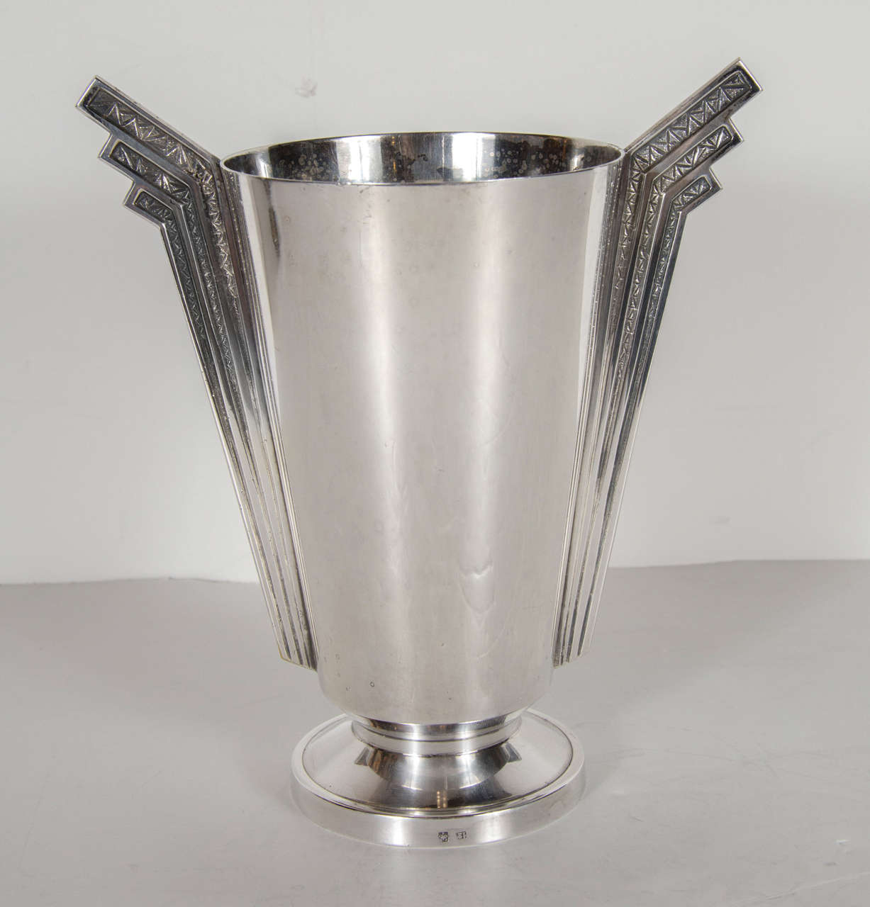 This stunning vase features a skyscraper style stylized handled silver plate vase with hand-forged cross hatch detailing.