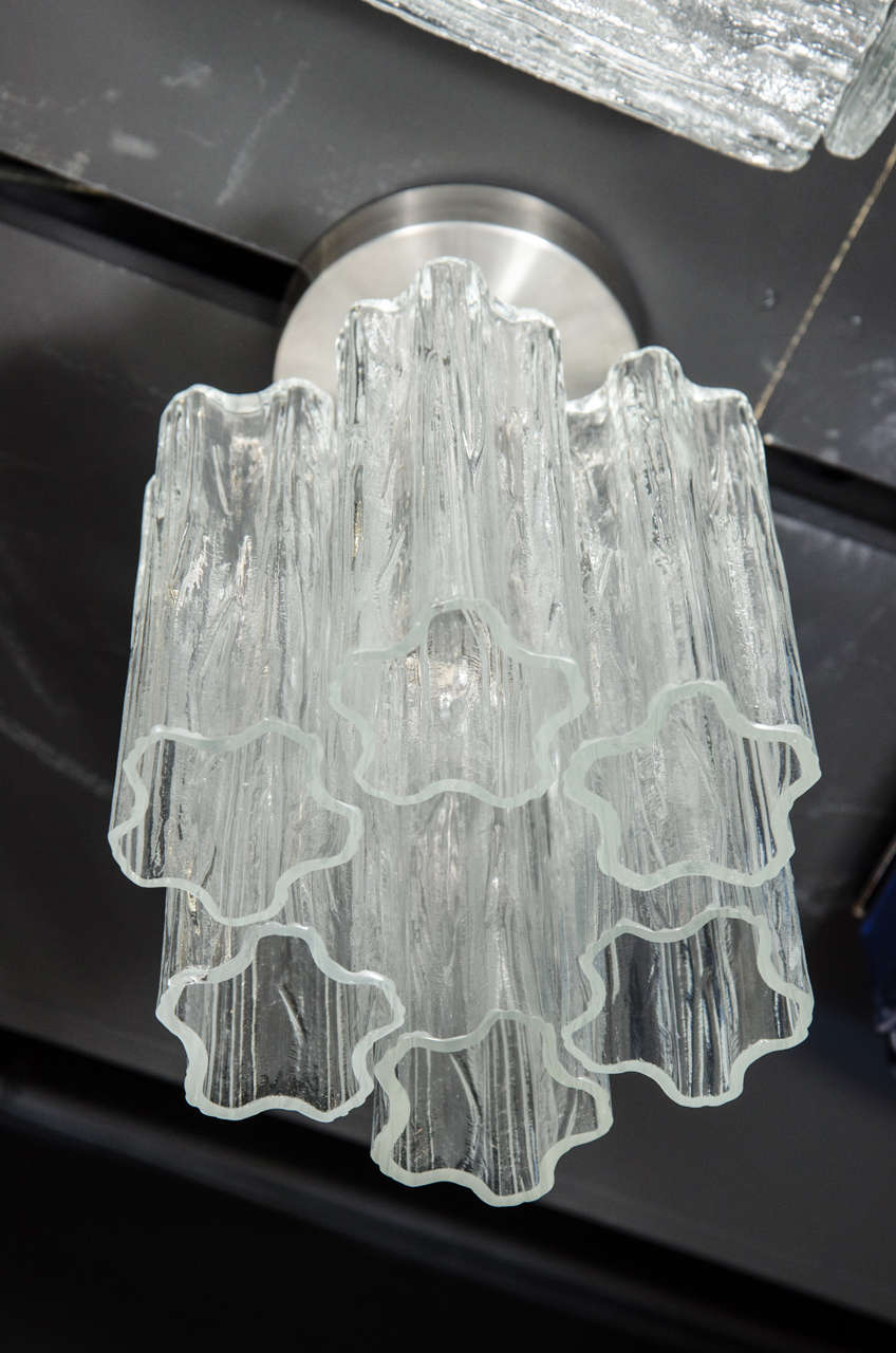 Mid-Century Modernist flush mount chandelier consisting of six hand-blown Murano glass Tronchi shades that are suspended from its brushed nickel streamlined canopy. The hand-blown Tronchi glass shades feature an organic, five-point shape and are
