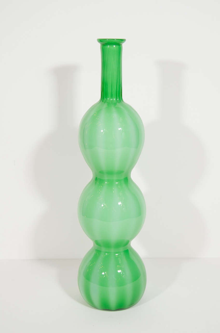 Modernist vase with triple gourd design in hand blown Murano glass. Ultra chic bulbous form with striped glass in hues of green and frosted white.