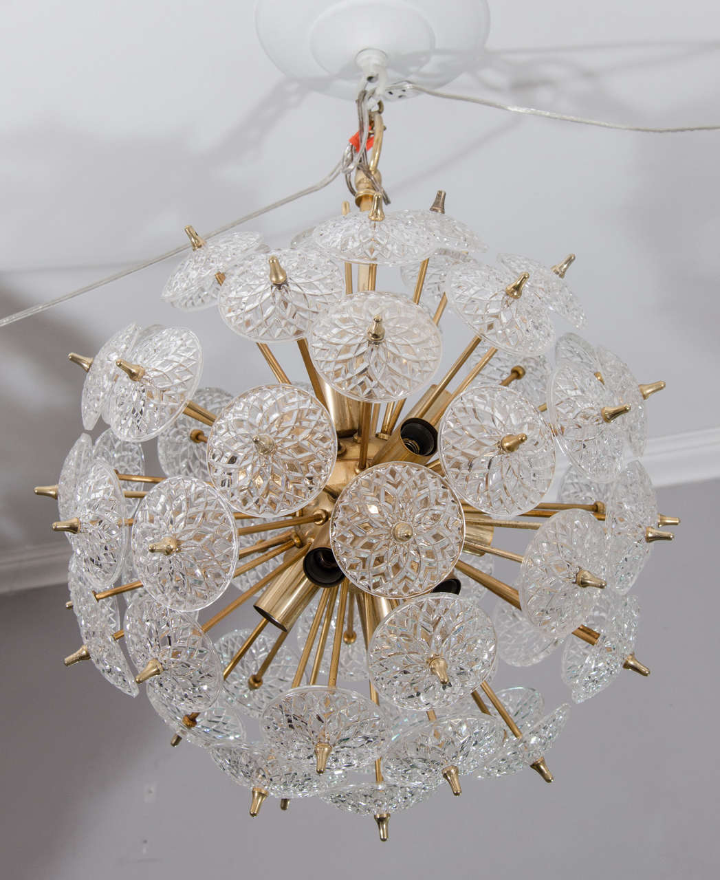 1970s Belgian snowflake glass chandelier in brass finish. Available for immediate purchase.