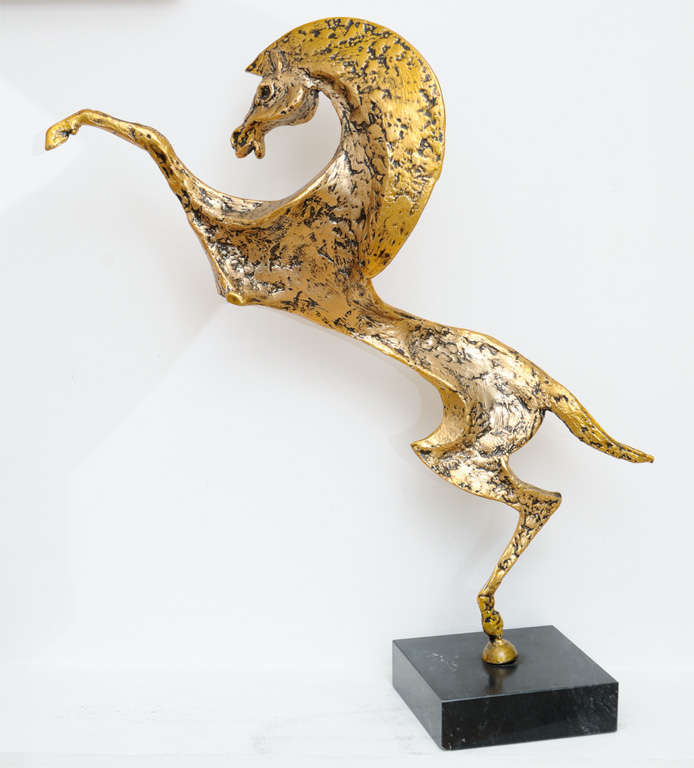 Modernist hammered bronze horse sculpture on a marble base.
