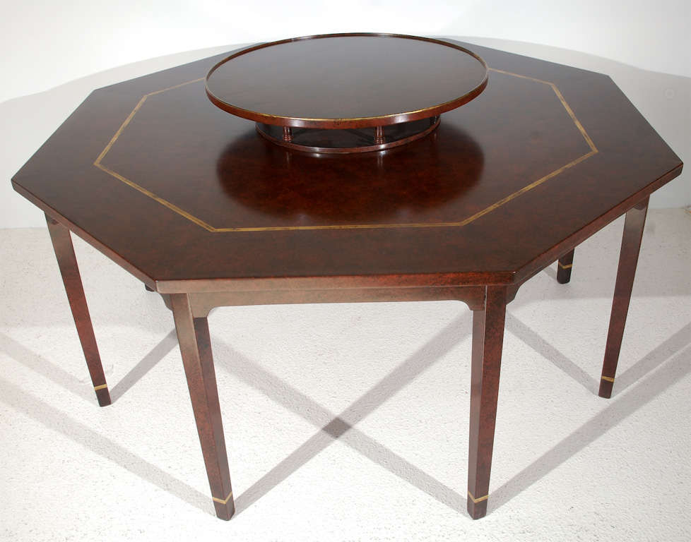 A striking octagonal table with a signature Haines painted finish, highlighted with gold detailing and a removable matching lazy susan custom designed by William Haines for Meredith and Rosemary Wilson. The dimensions given below are for the table