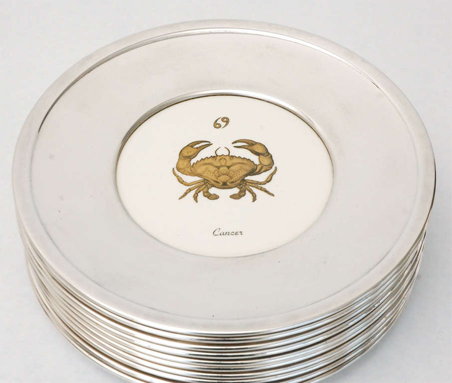 American Set of Thirteen Silver Plate and Ceramic Zodiac Plates