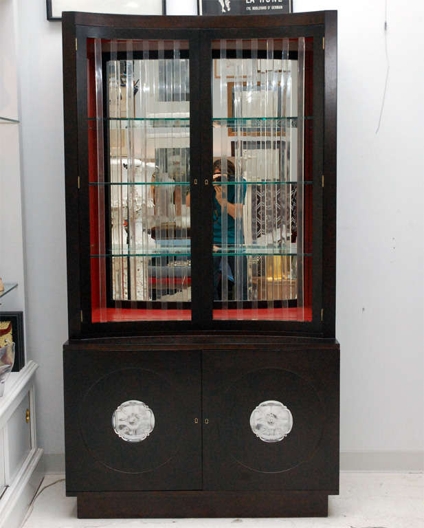 A fantastic mahogany display cabinet with Lucite details by Grosfeld House. Fully restored with a dramatic red interior.