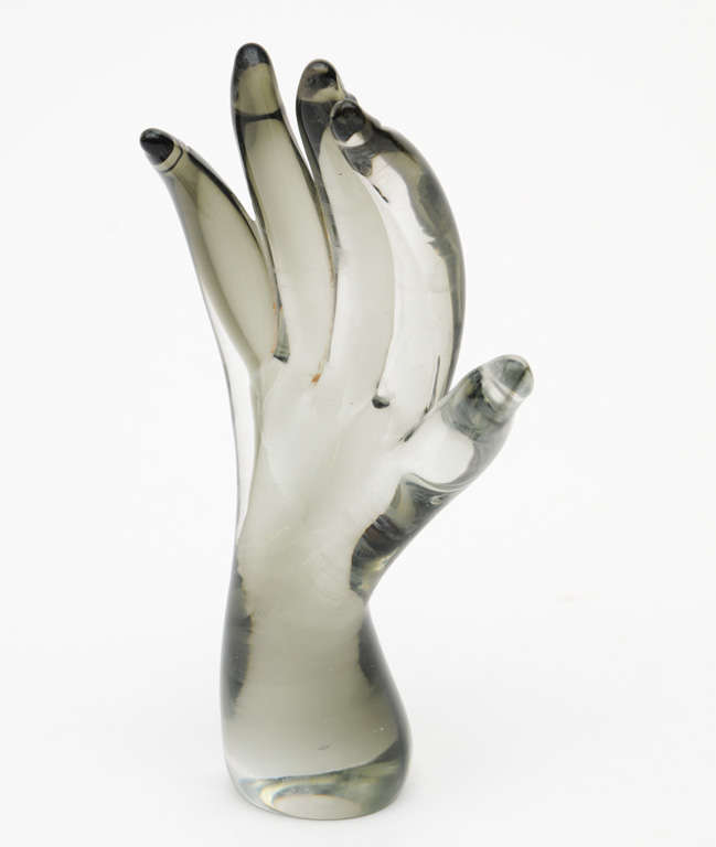 Hand formed grey glass  in the shape of a hand