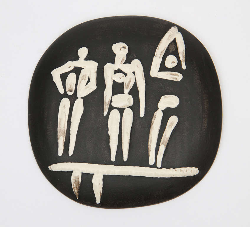 Picasso wall plaque depicting divers highlighted by the use of a stark white glaze with a black background.Similar to figure #424/pg.177 ramie(Picasso's Ceramics)
stamped on the verso madoura and originale de picasso
