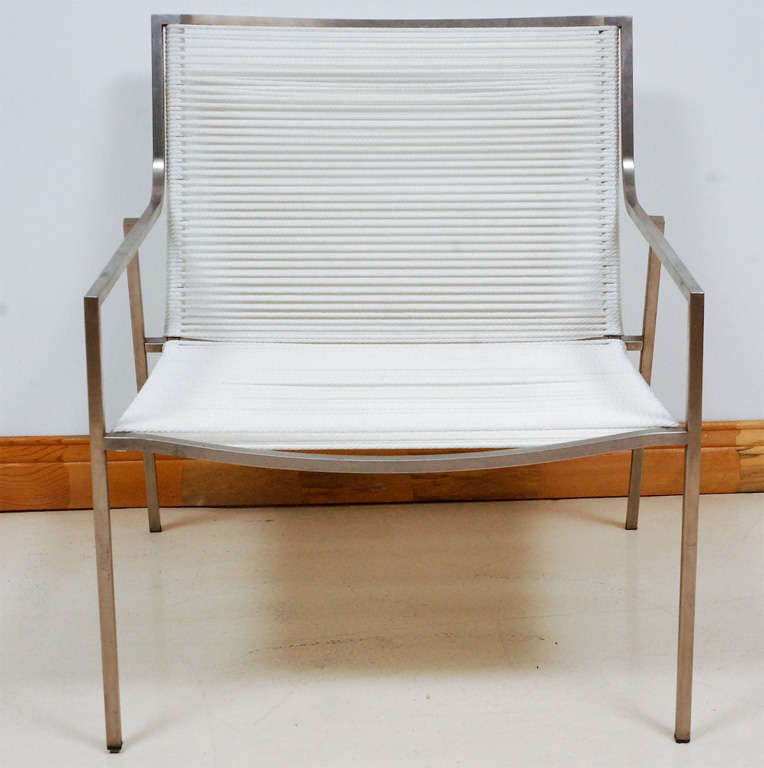 Pair of 1960's mid-century stainless steel frame lounge chairs.  Can go indoors or out.