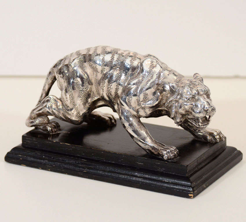 A 20th century Italian sterling silver tiger on an ebonized wood base, the silver hallmarked Florence