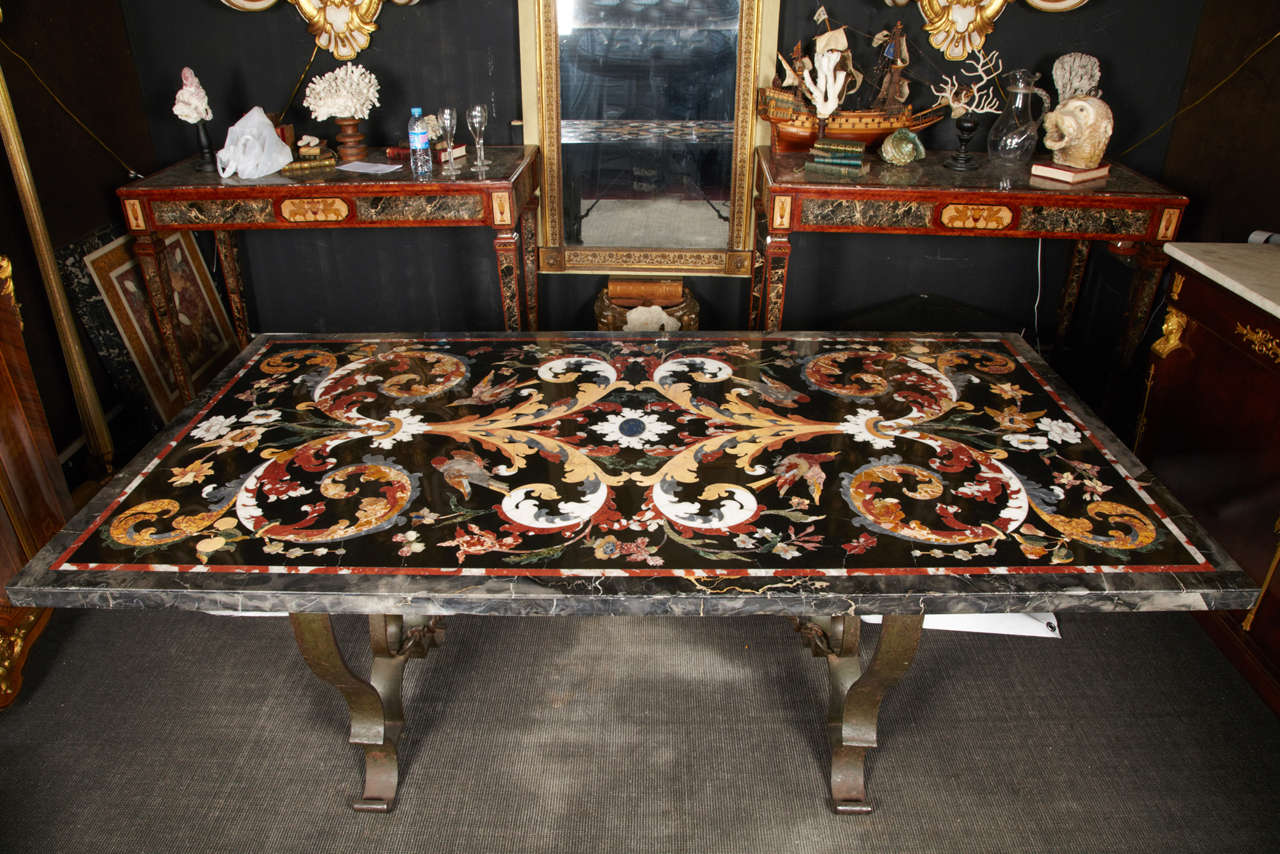 20th Italian marble table with marquetry, inlays of different stones 
(yellow sienna, red verona, Brocatello from spain, flowered alabaster, 
black belgium, white Carrara, green empire, mother of pearl, portoro, 
etc.)
base wrought iron in green