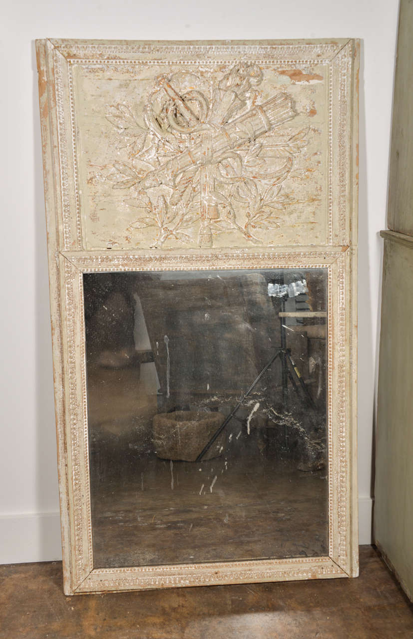 Beautifully carved Trumeau with intricate detail. Original paint and mirror.