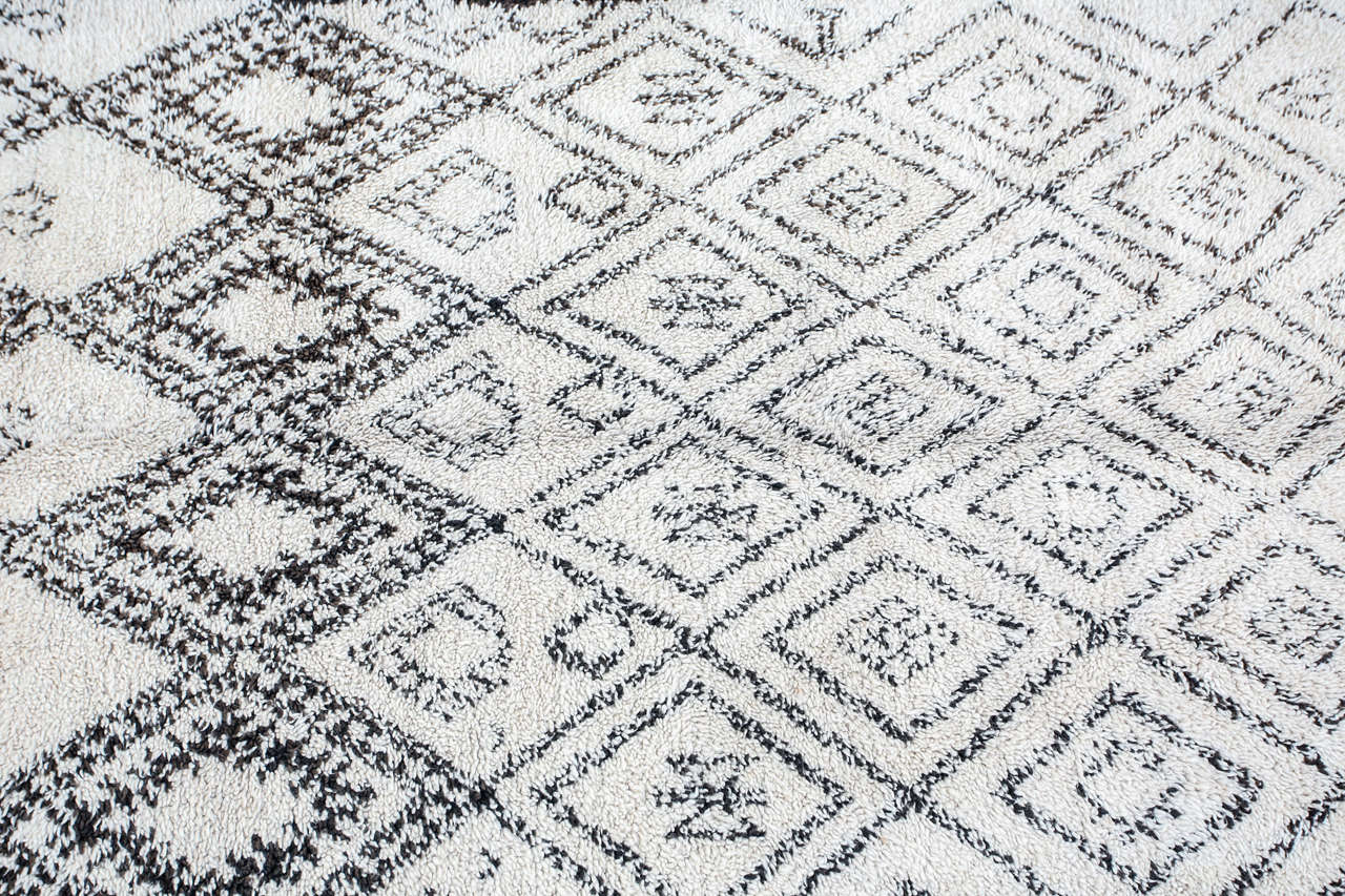 Vintage Moroccan tribal rug from Beni Ouarain Tribe. Handmade from organic undyed sheep wool. Great modernist rugs, works very well with Mid-century Modern furniture.

Mosaik provides Antiques in Moorish style, Spanish, African Tribal Art, Islamic