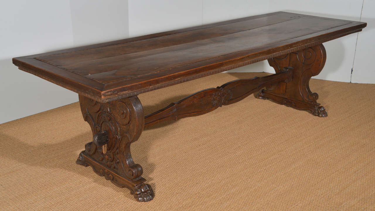 Late 17th century finely carved walnut table with inlaid detail and carved apron added in the 18th century.