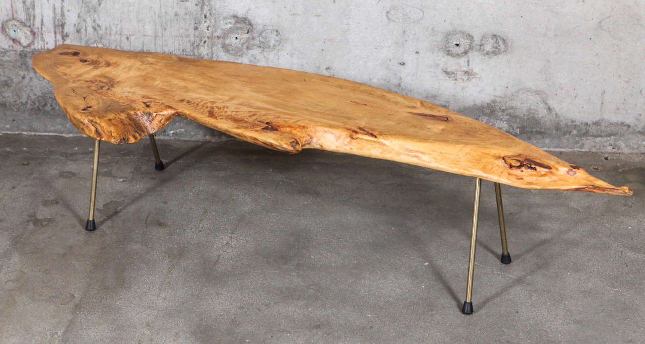 A burl wood coffee table by Carl Auböck.