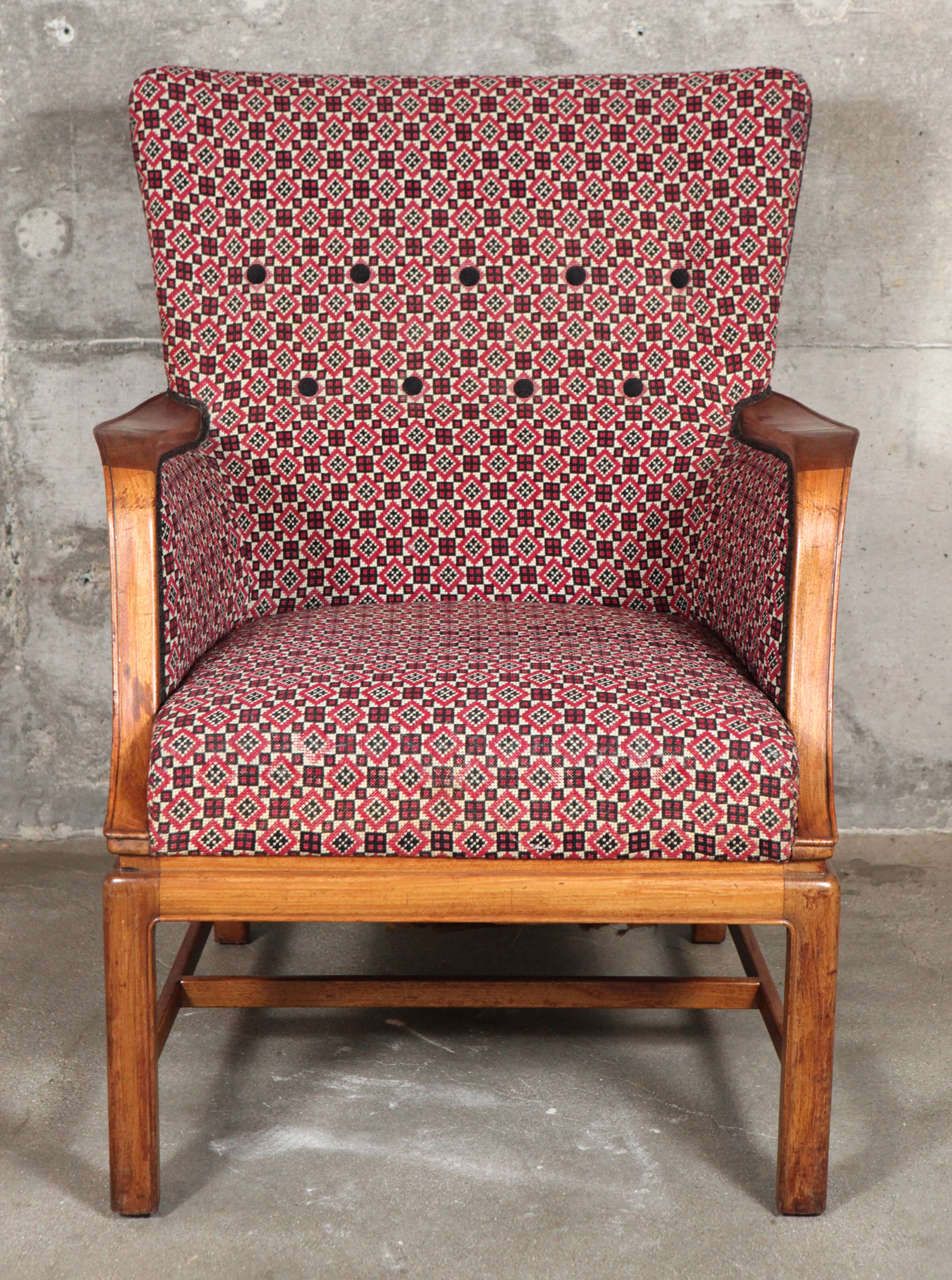 Frits Henningsen easy chair with mahogany frame in fabric.