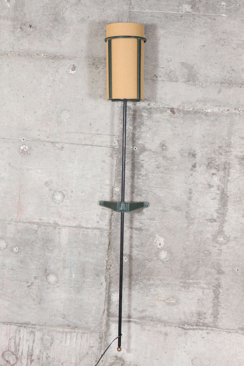 France, leather-wrapped Jacques Adnet wall torchère, 1950s.