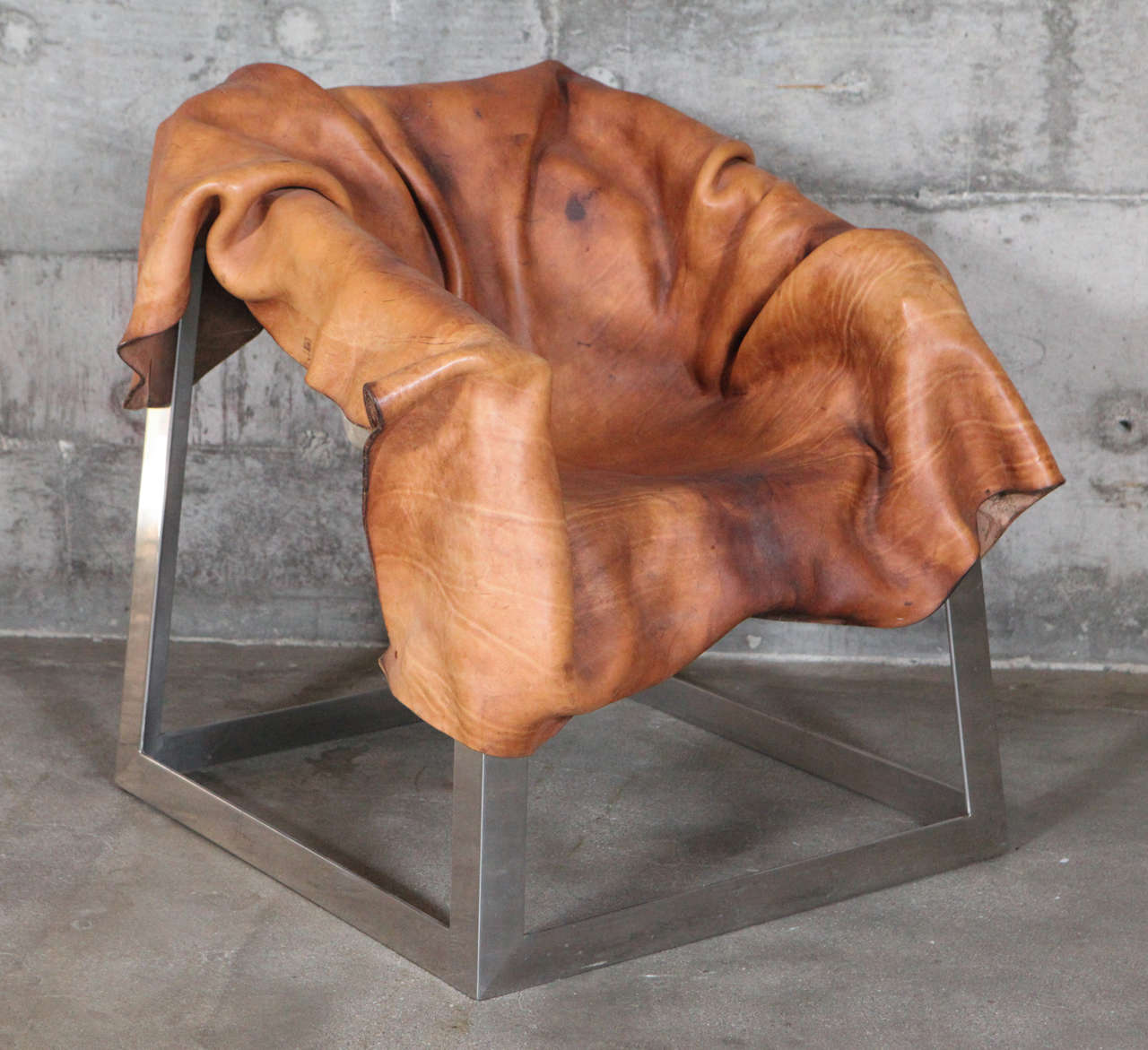 Simon Hasan chair, boiled leather and stainless steel.