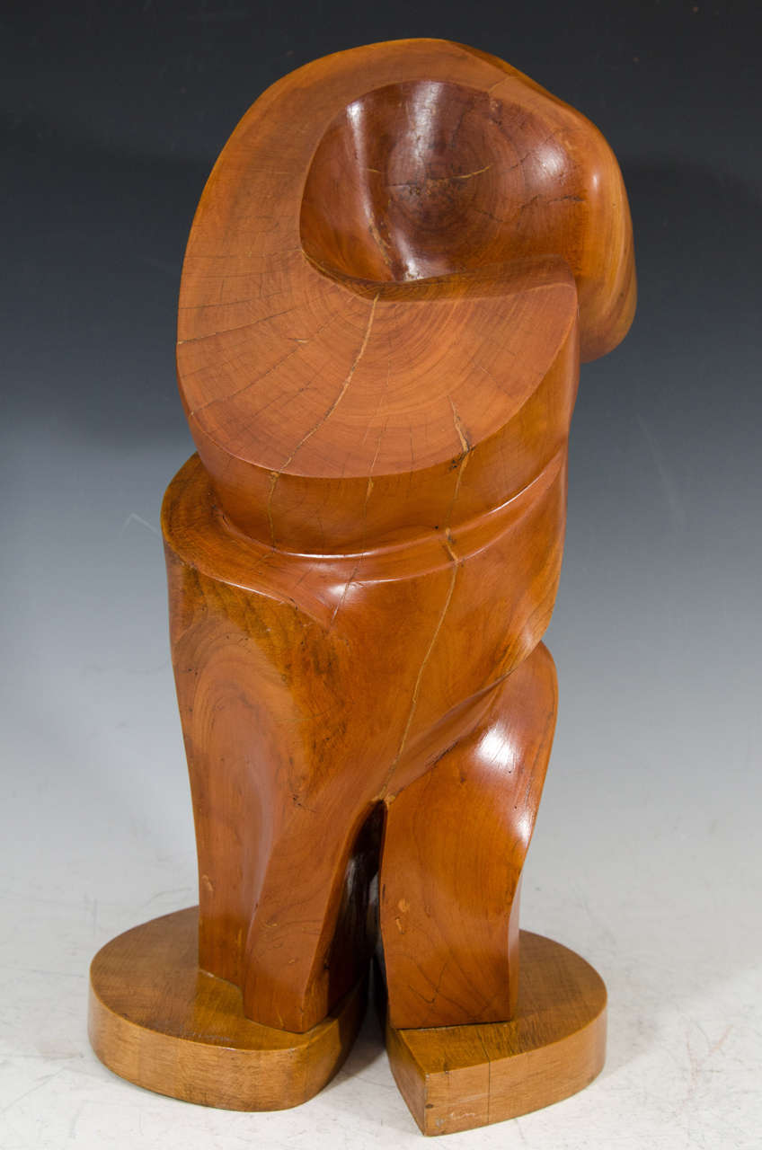 A vintage carved wooden abstract sculpture by Edmund Spiro and signed E. Spiro.

Spiro is a World War II veteran from New Jersey. He began sculpting in his 1940s. He studied at Kean University and graduated summa cum laude with a B.A. in Fine