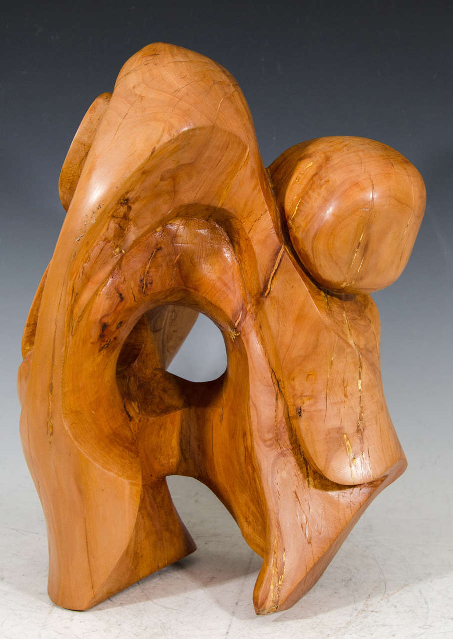 A vintage carved wooden abstract sculpture by Edmund Spiro and signed E. Spiro.

Spiro is a World War II veteran from New Jersey. He began sculpting in his 40s. He studied at Kean University and graduated summa cum laude with a B.A. in Fine Arts.